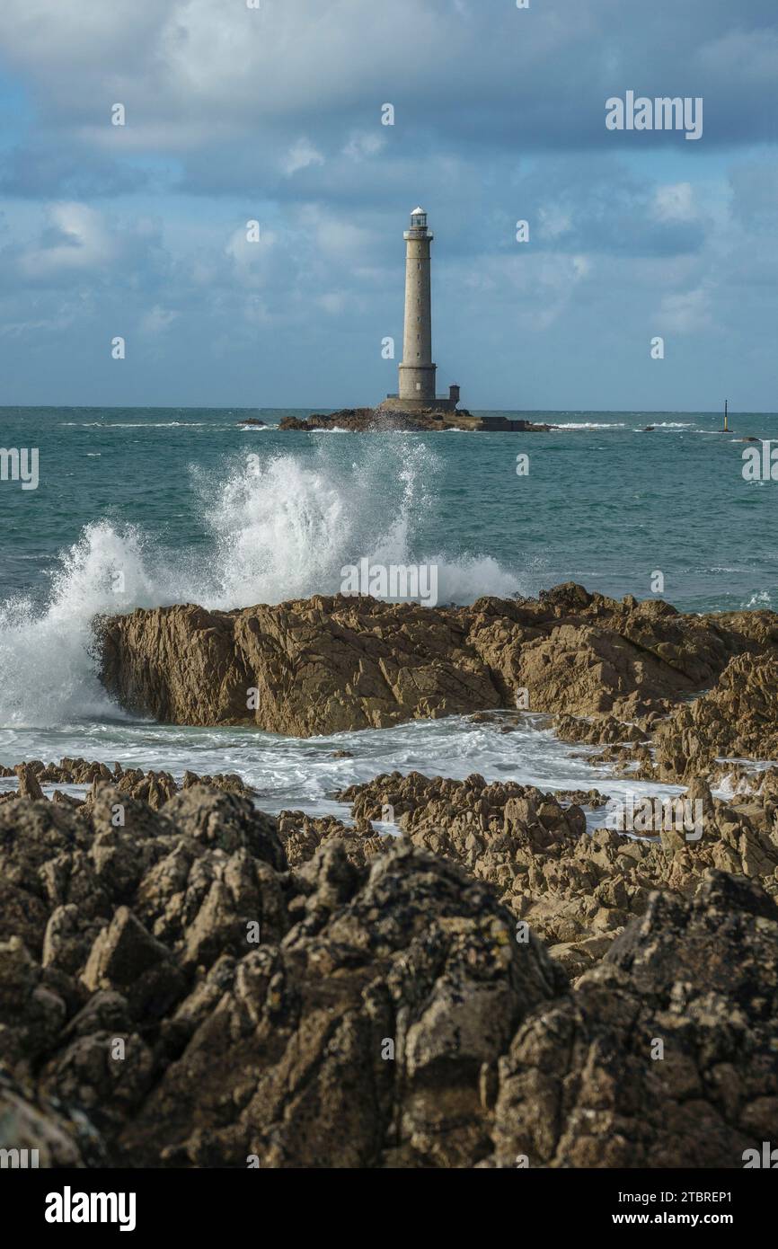 France, Normandy, spray of waves on the rocks at the sea, Phare de La Hague, lighthouse Phare de Goury near Auderville, Cap de La Hague, peninsula Cotentin, Basse Normandie Stock Photo