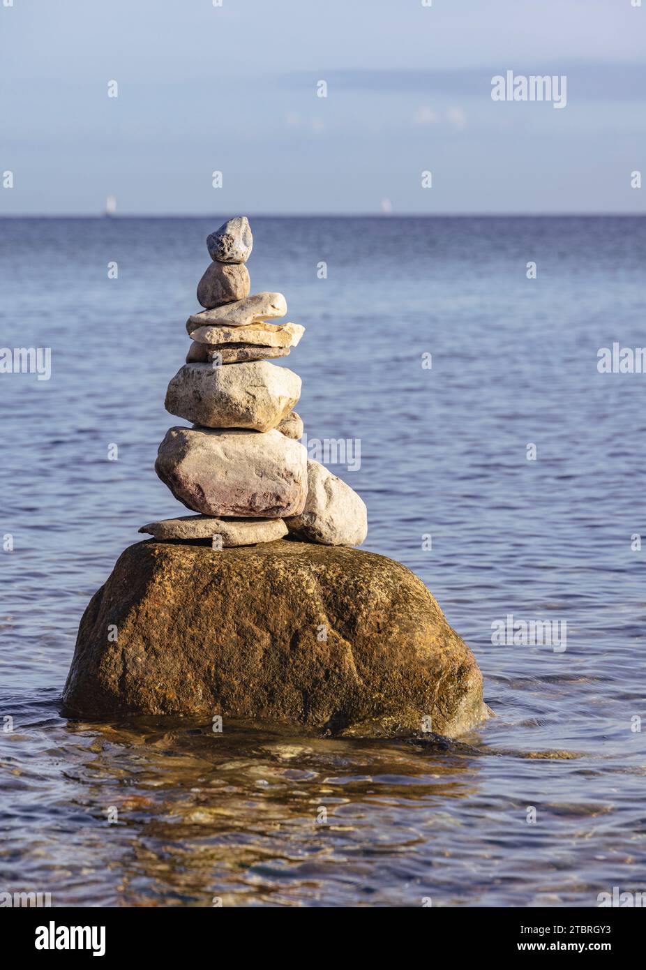 Cairn, tower of stones on the beach at Schönhagen Stock Photo