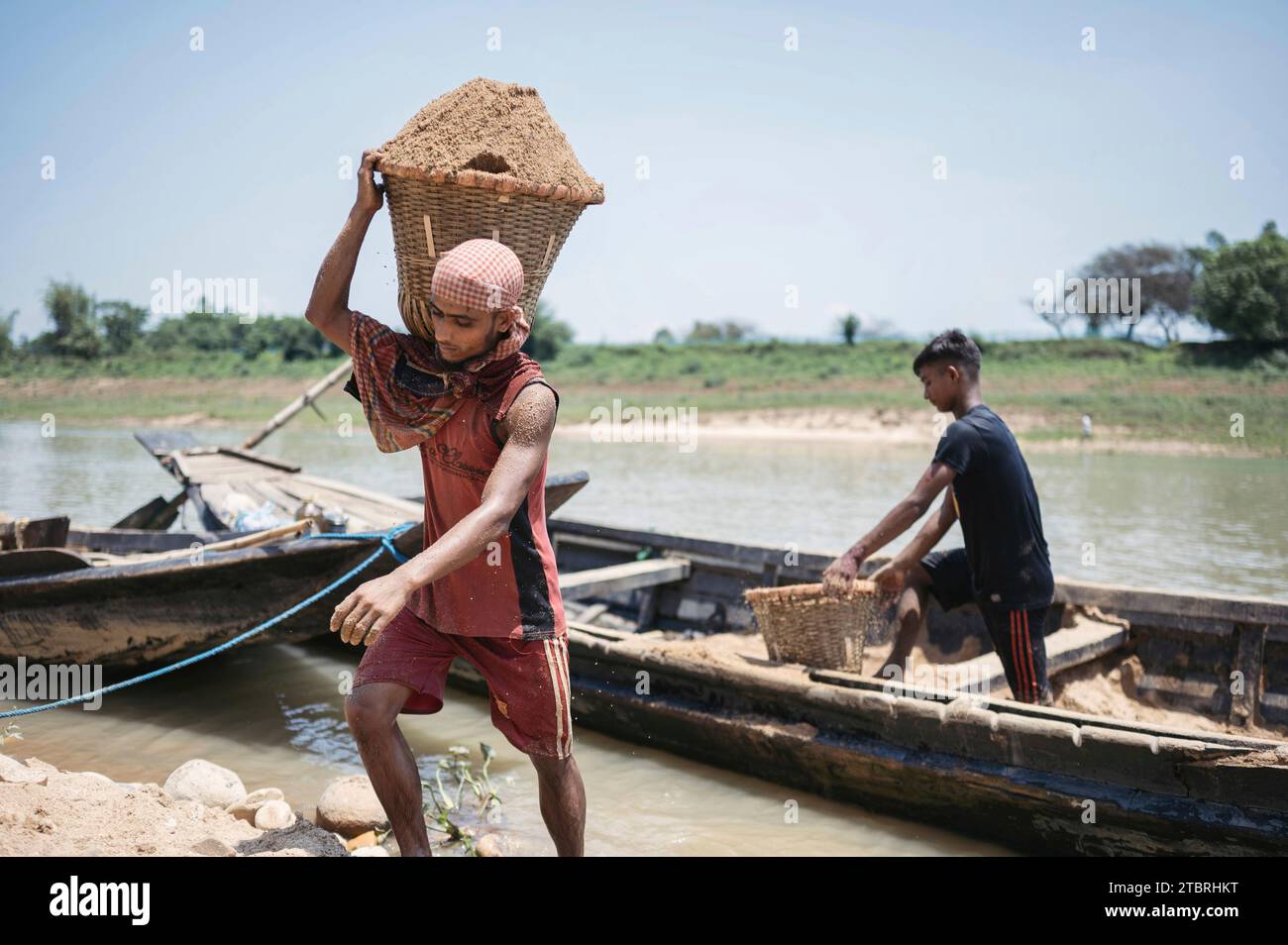 Men working at a high-quality sand collecting site, for the construction industry of the country. Lalakhal, near Jaflong, Sylhet Bangladesh Stock Photo