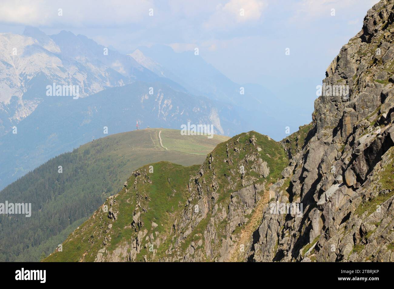 View back on the hike to Hundstalsee (2289m), Rangger Köpfl radio station, in the foreground the ridge to Mitterkogel, Inzing, Stubai Alps, Tyrol, Aus Stock Photo