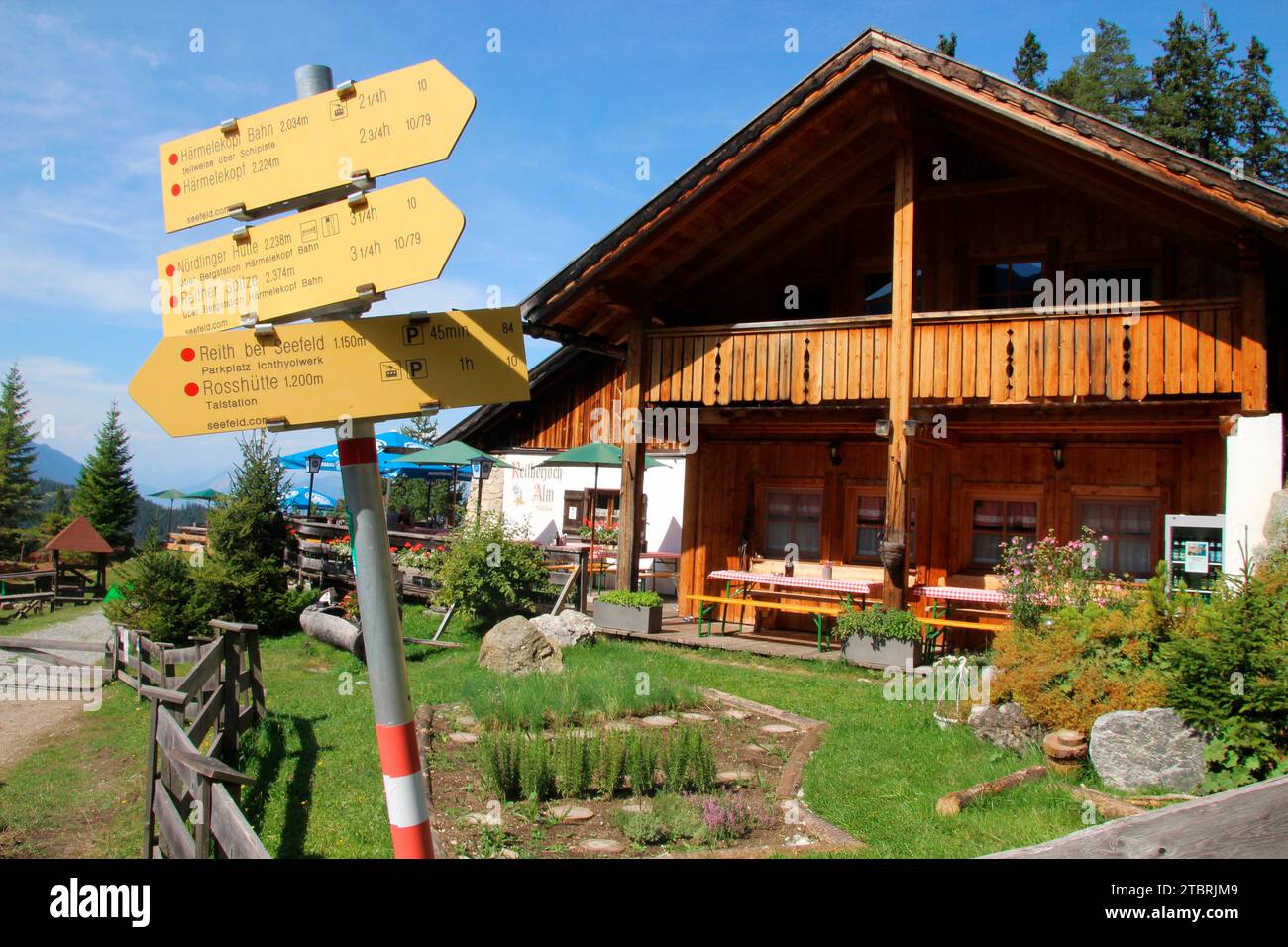 On the edge of the Karwendel mountains at 1,500 meters, in the Rosshütte ski area and halfway up to the Härmelekopf lies the rustic Reitherjoch Alm, R Stock Photo