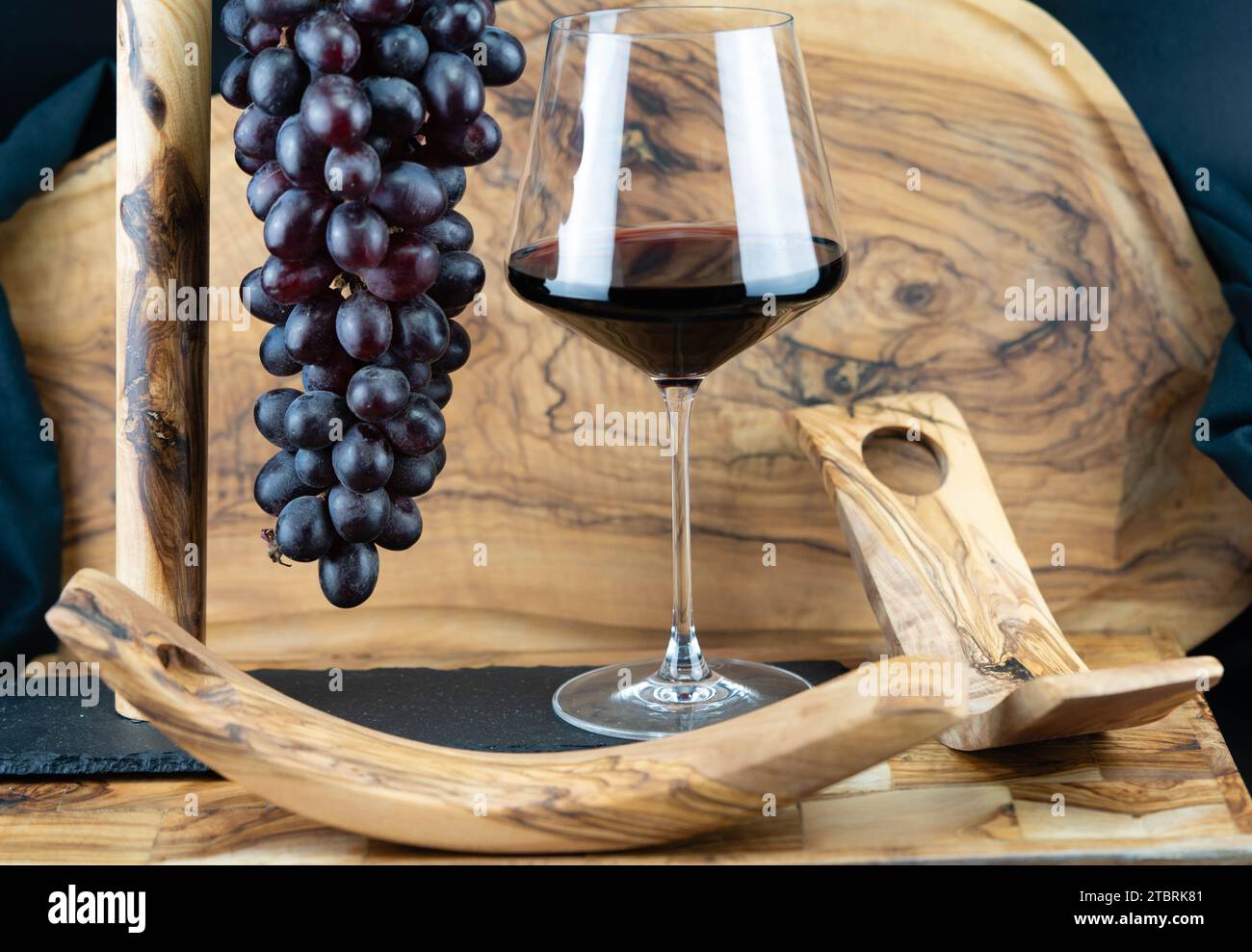wine grapes and redwing on olive wood Stock Photo