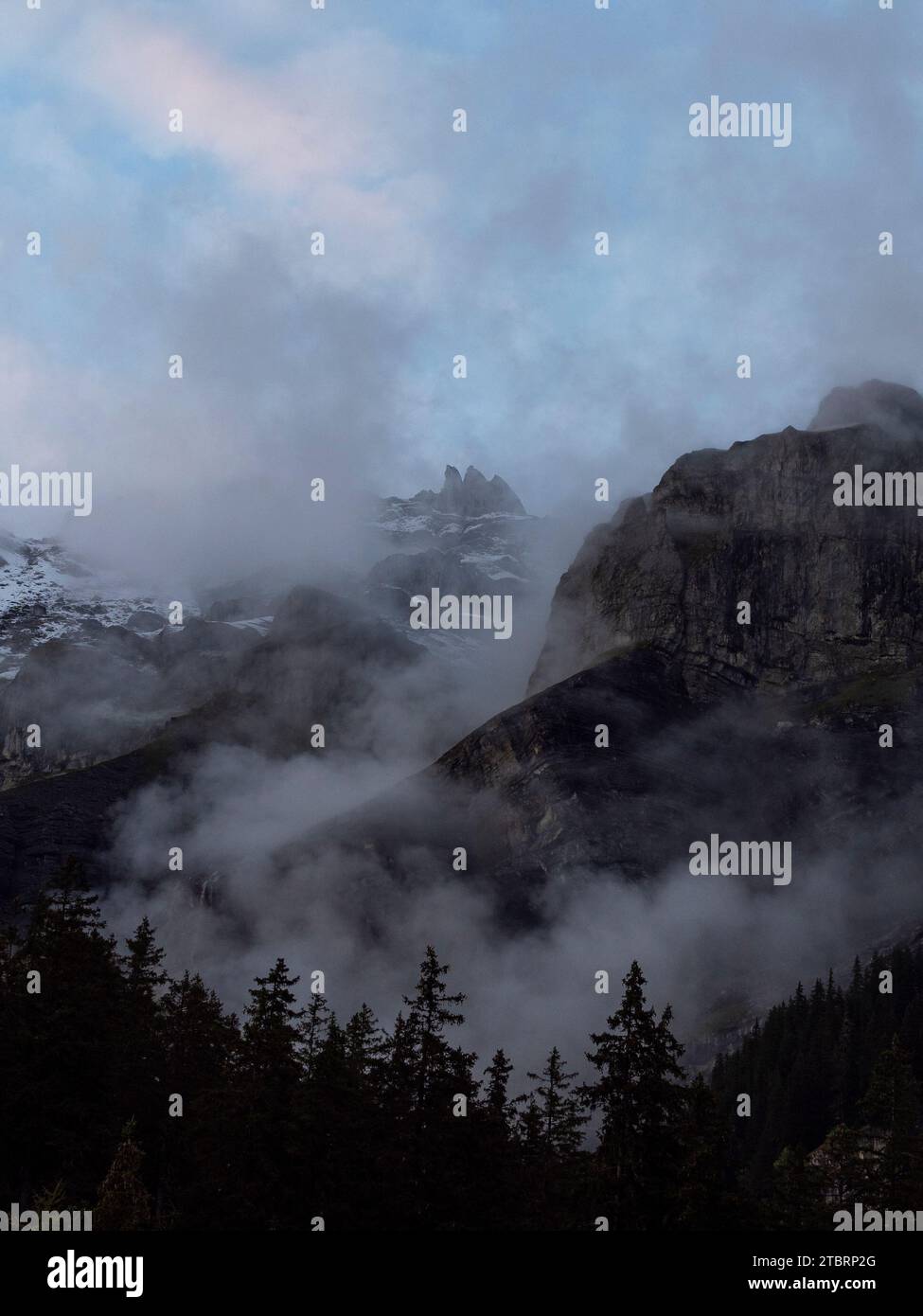 The mountains near Kandersteg, shrouded in clouds Stock Photo - Alamy