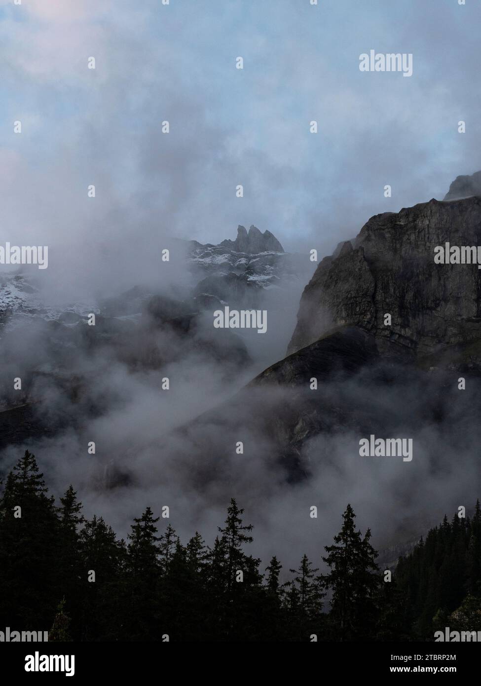 The mountains near Kandersteg, shrouded in clouds Stock Photo - Alamy