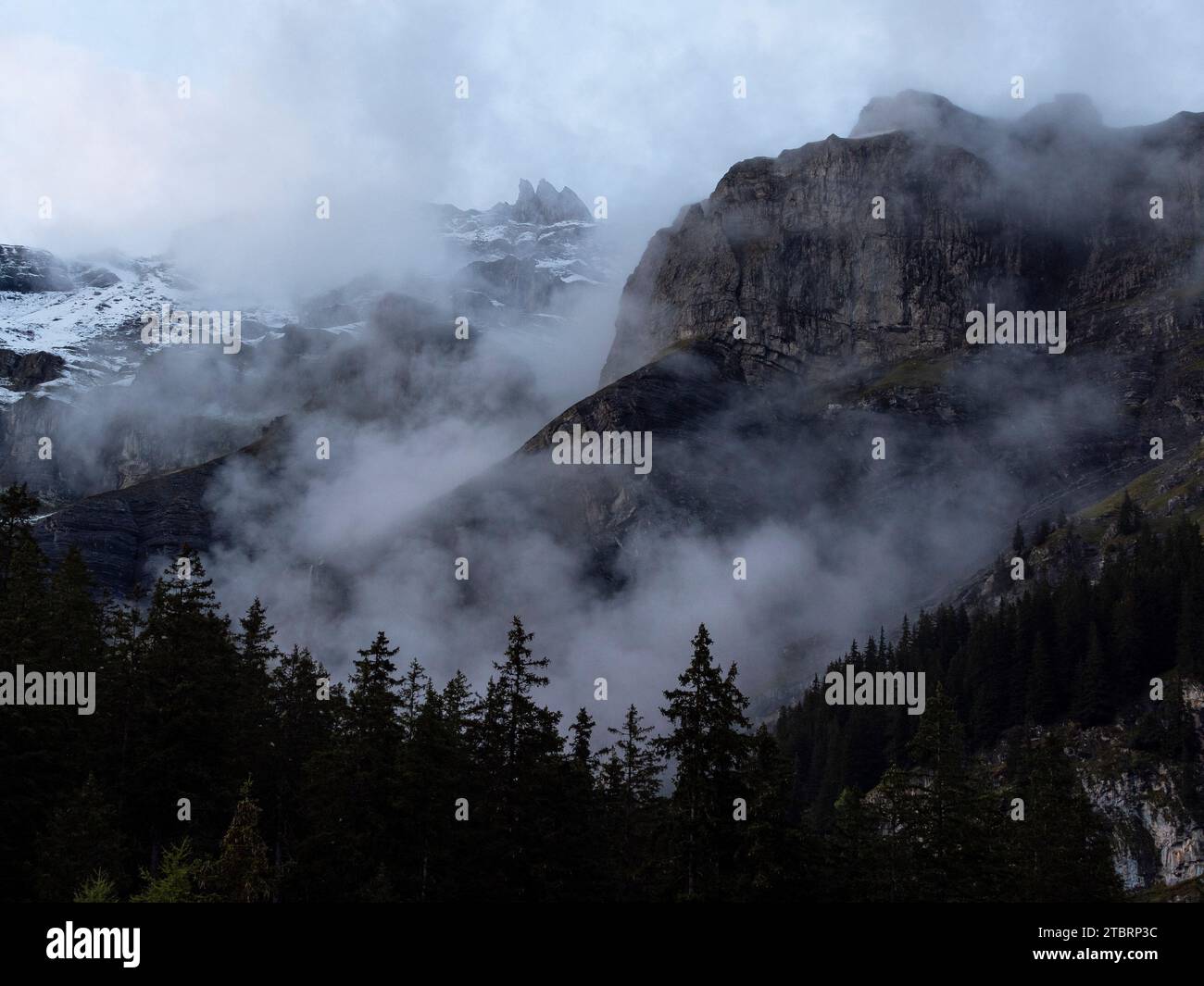 The mountains near Kandersteg, shrouded in clouds Stock Photo - Alamy