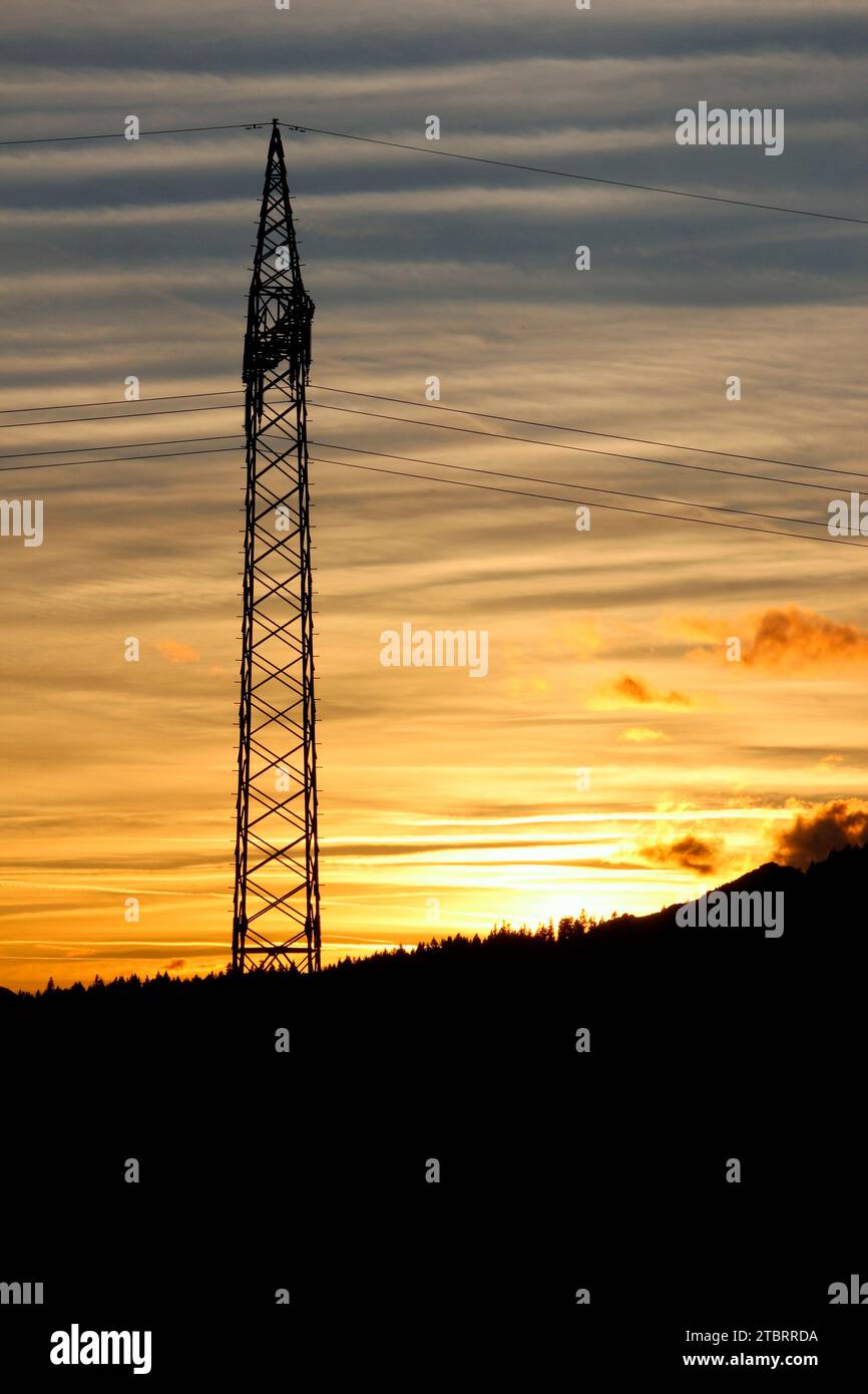 Power pole at sunset in the humpback meadows near Krün, Germany, Bavaria, Upper Bavaria, Isarta Stock Photo