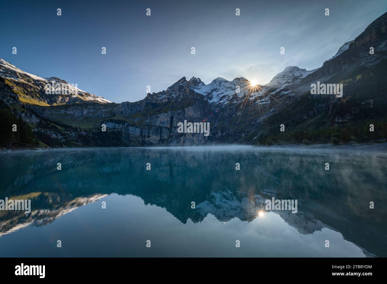 View of Lake Oeschinen near Kandersteg at sunrise Stock Photo - Alamy