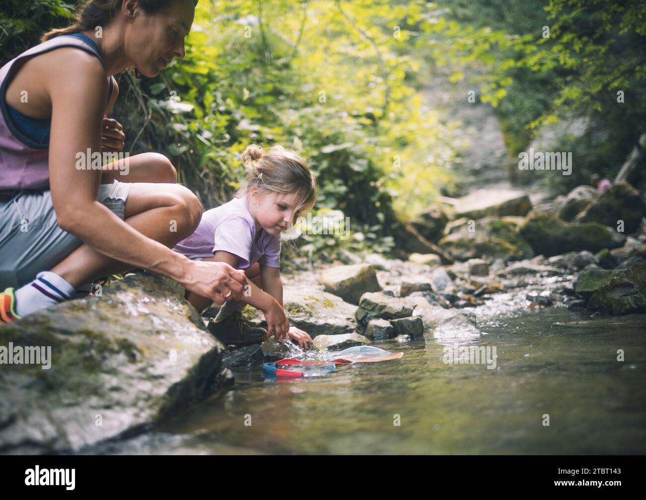 Family hike to the waterfall trail in Nesselwang Stock Photo