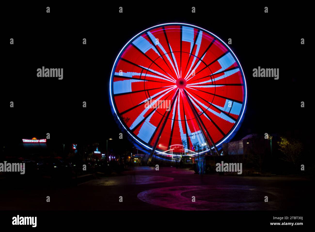 Glowing Ferris Wheel at Night in Pigeon Tennessee Stock Photo