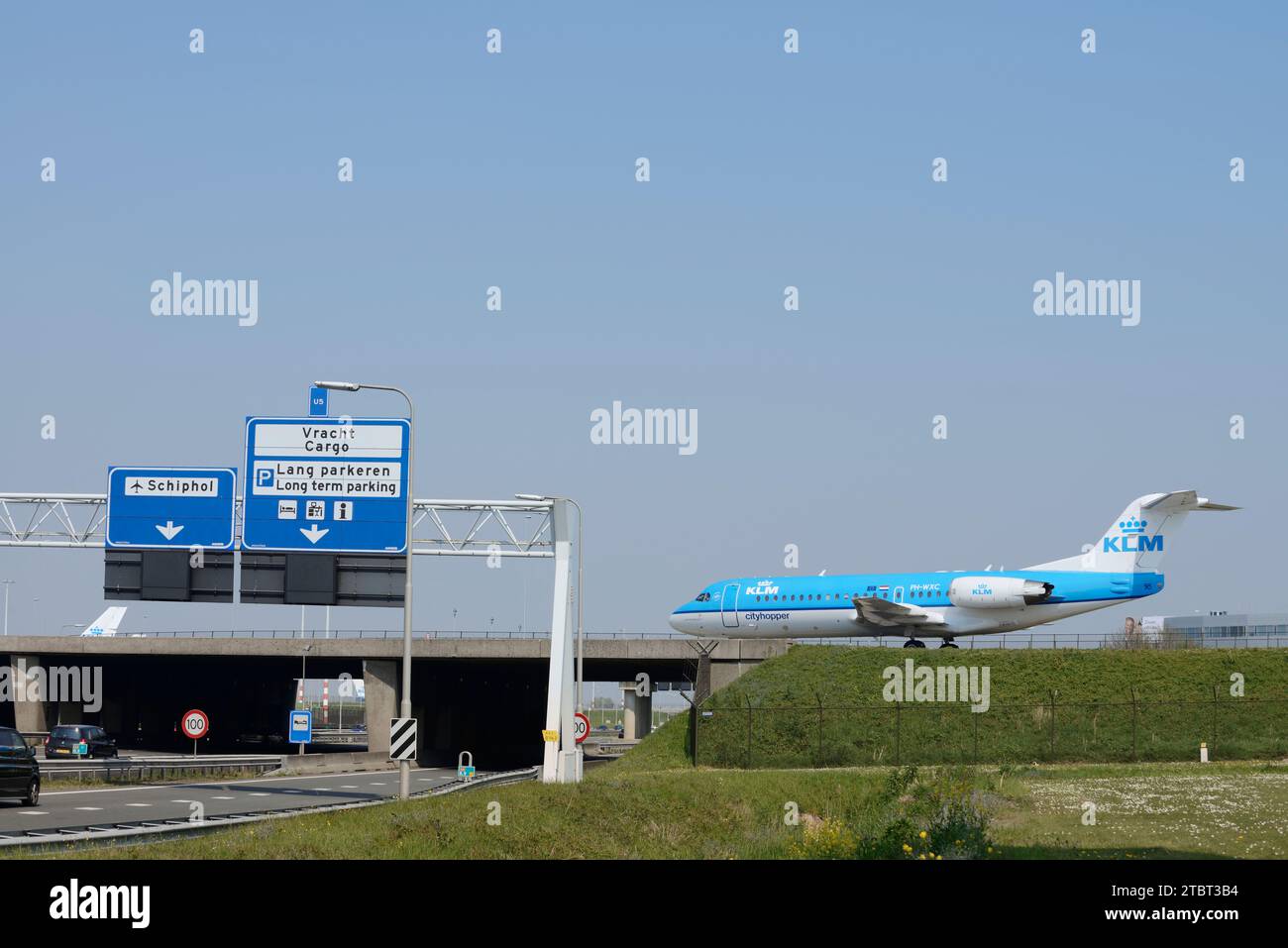 Airplane on bridge over A4 highway, Amsterdam-Schiphol Airport, North Holland, Netherlands Stock Photo