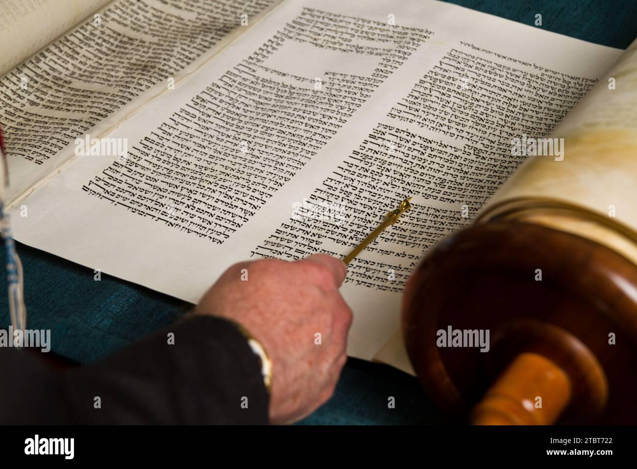 Close-up View of Torah Reading with Yad in Synagogue Stock Photo