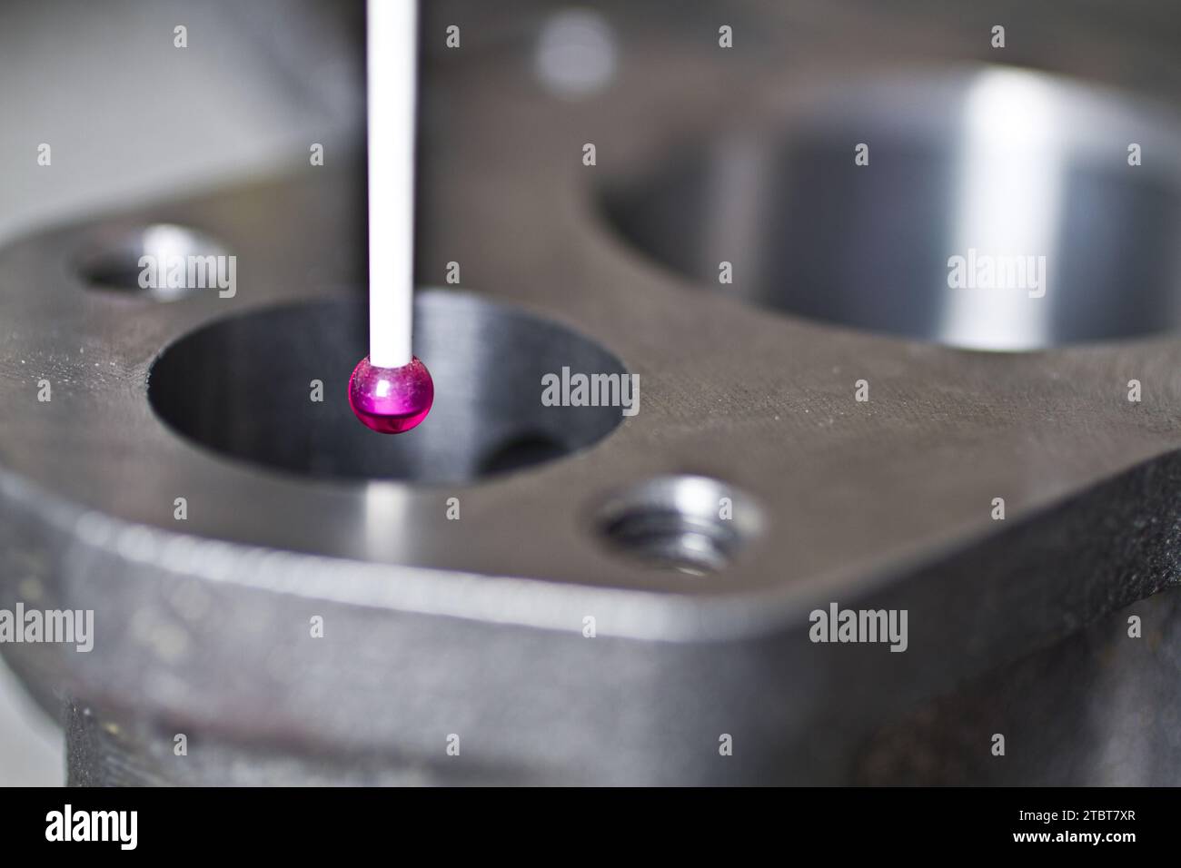 CMM Programming Precision Measurement in Industrial Setting with Magenta Probe Stock Photo