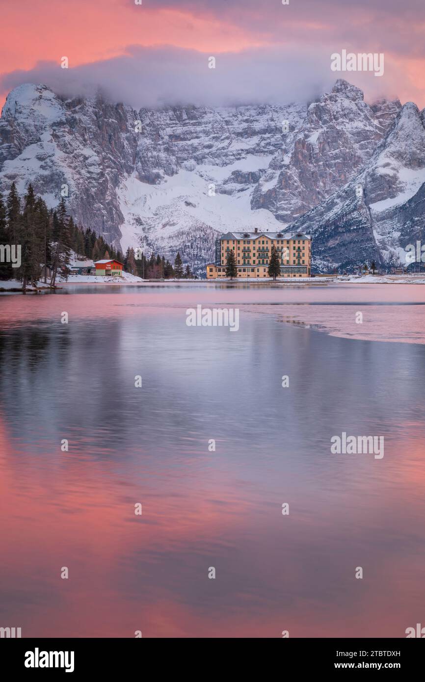 Italy, Veneto, province of Belluno, Auronzo di Cadore, iconic view of Misurina with the lake and mount Sorapis in background, breathtaking sunset, Dolomites Stock Photo