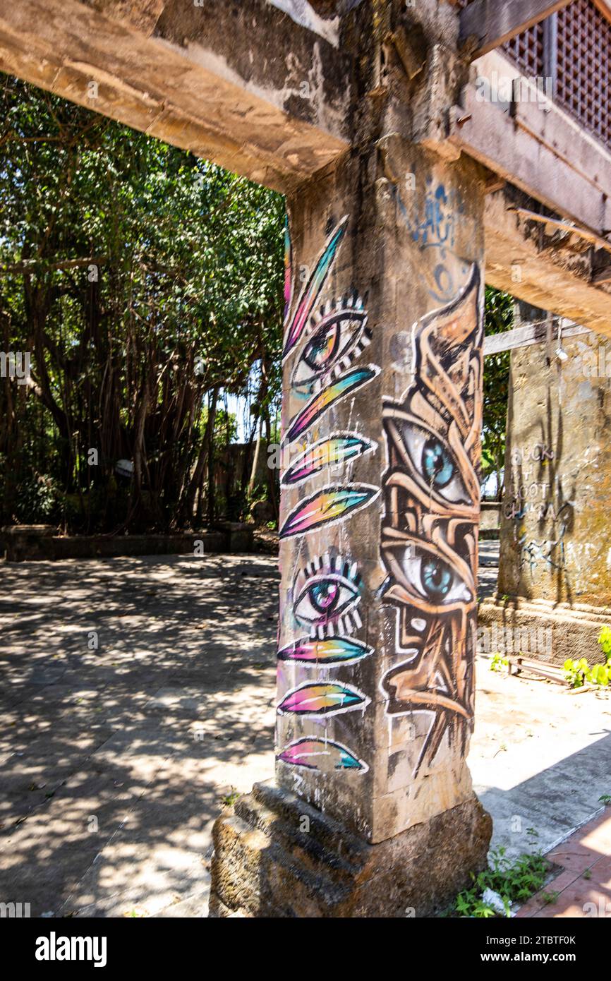 Graffiti on the grounds of Taman Festival Bali, Padang Galak, a lost place in Bali, Indonesia, a former water and amusement park that is being reclaimed by nature Stock Photo