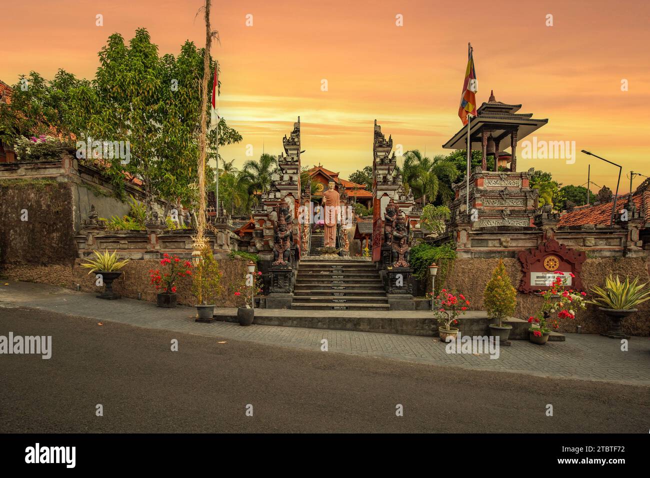 A Buddhist temple in the evening in the rain, the Brahmavihara - Arama temple has beautiful gardens and also houses a monastery, tropical plants near Banjar, Bali Stock Photo
