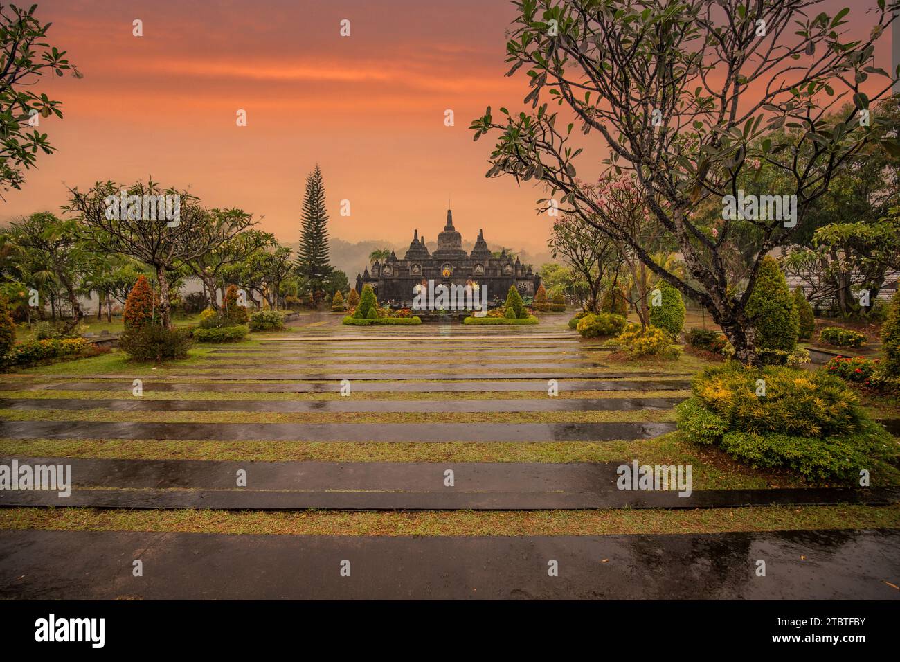 A Buddhist temple in the evening in the rain, the Brahmavihara-Arama temple has beautiful gardens and is also home to a monastery, tropical plants near Banjar, Bali Stock Photo