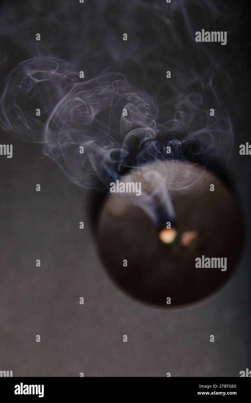 Ethereal Smoke Dance from Extinguished Candle in Tranquil Dim Light Stock Photo