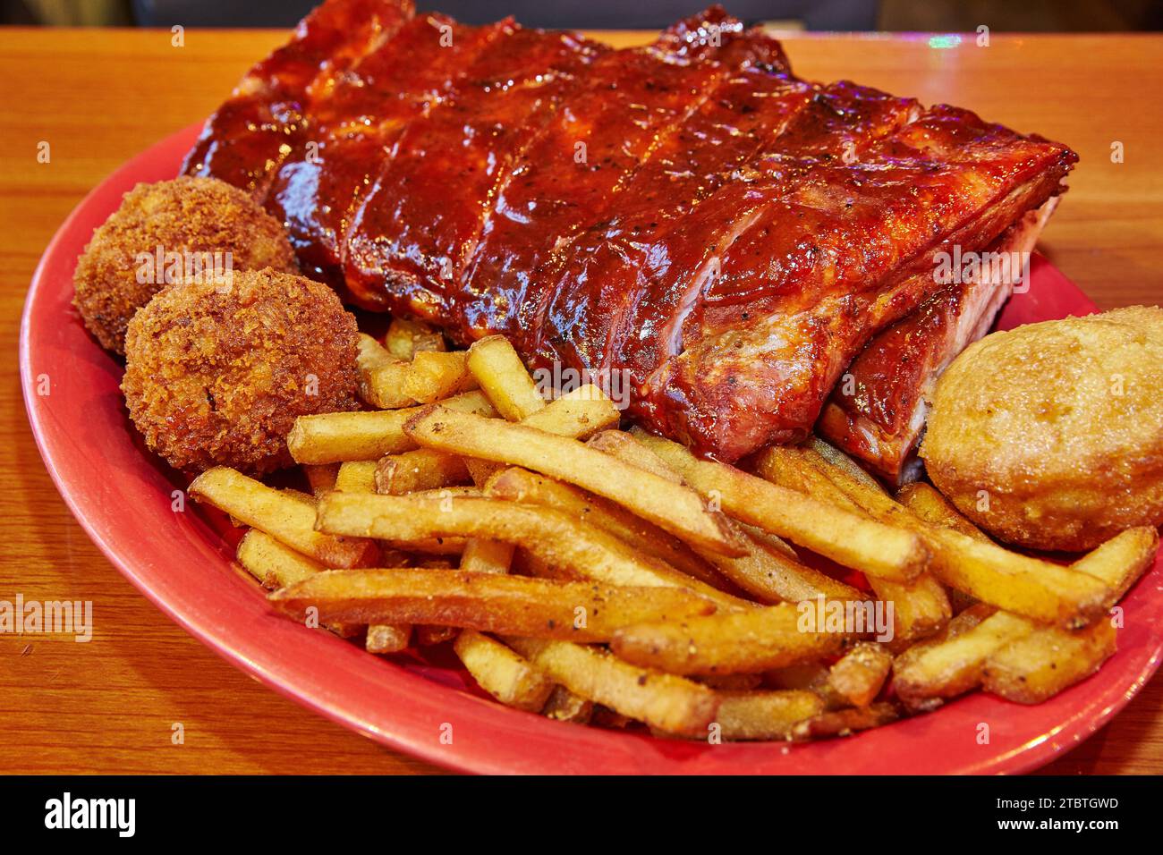 American Barbecue Platter with Pork Ribs and Sides on Red Plate Stock Photo Alamy