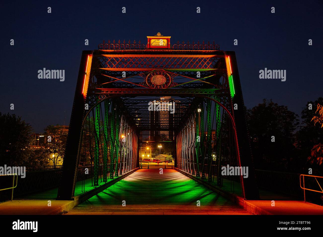 Illuminated Orange and Green Wells Street Bridge in Downtown Fort Wayne