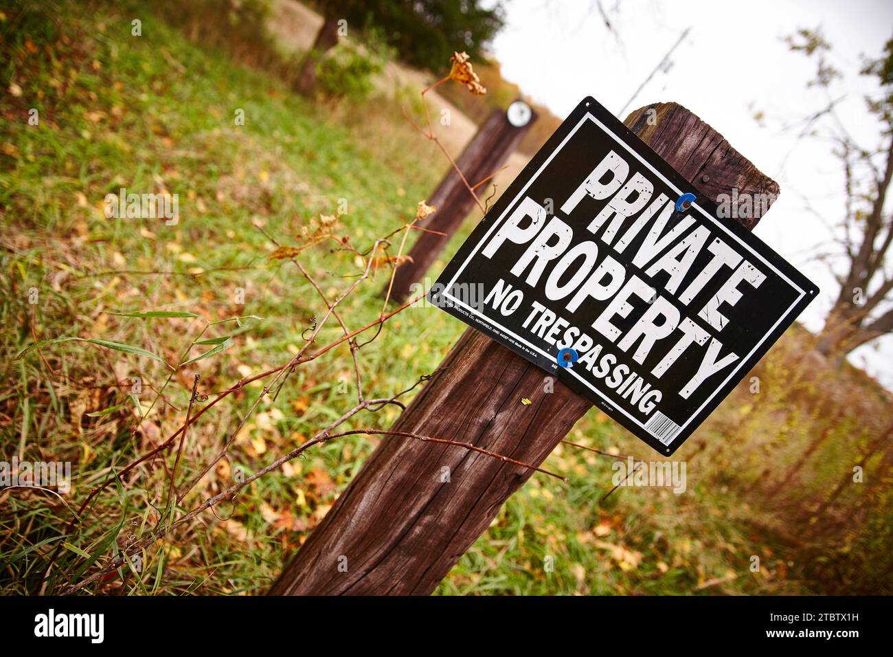 No trespassing, No hunting, No fishing, No trapping sign on fence