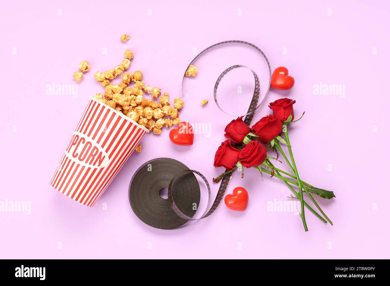 Popcorn At Roses Bucket of popcorn with film reel, beautiful roses and hearts on lilac ...