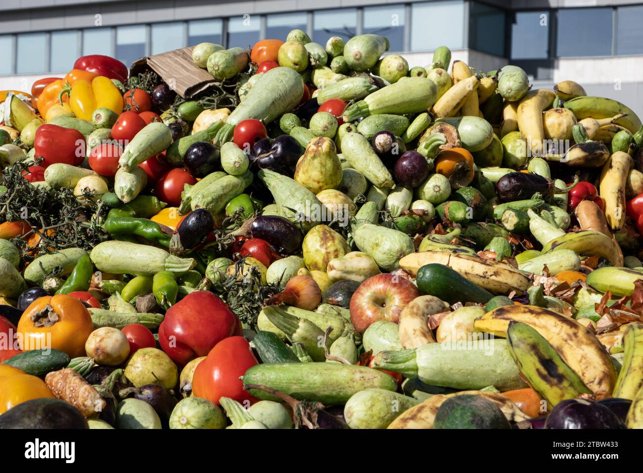 Heap of Mix expired Vegetables and fruits at harvest time. Organic bio waste in a huge container