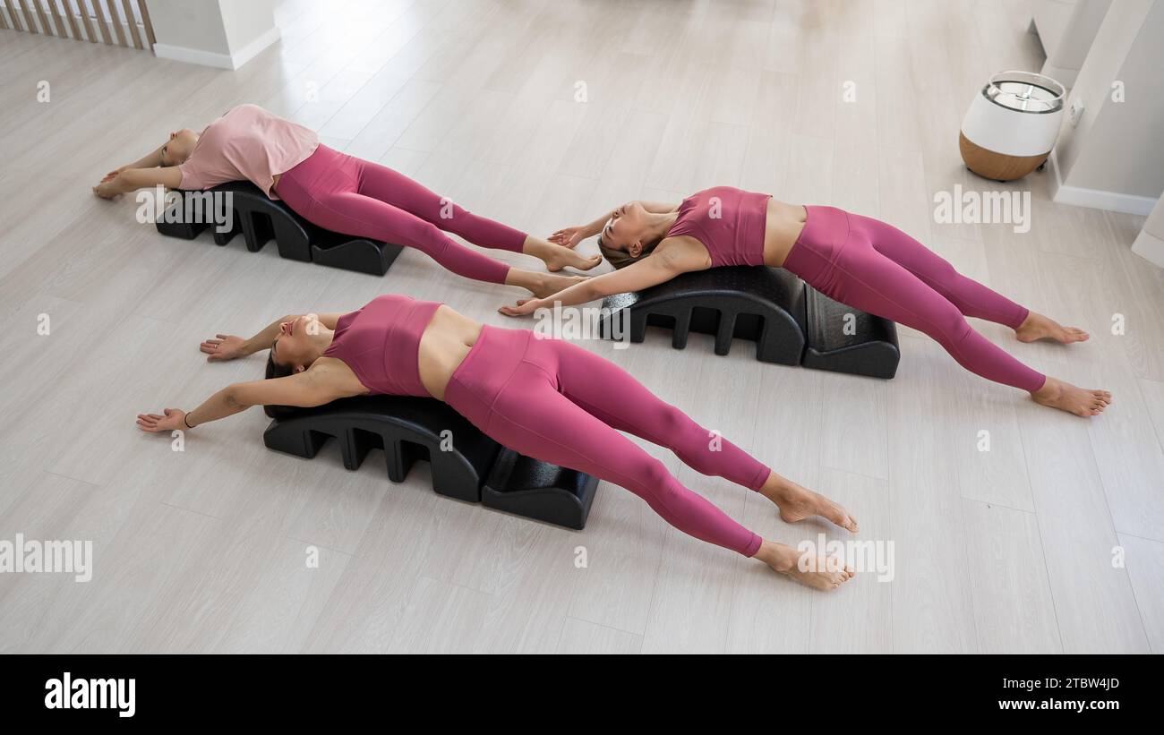 Balanced Body Pilates Arc. Three asian women exercising on pilates arc  Stock Photo - Alamy