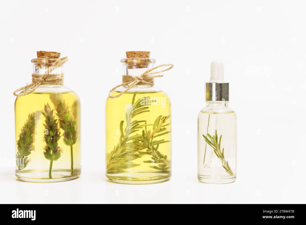 bottle and dropper with rosemary and lavender essential oil with fresh ...