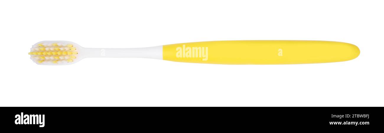 Yellow plastic toothbrush isolated on white, top view Stock Photo - Alamy