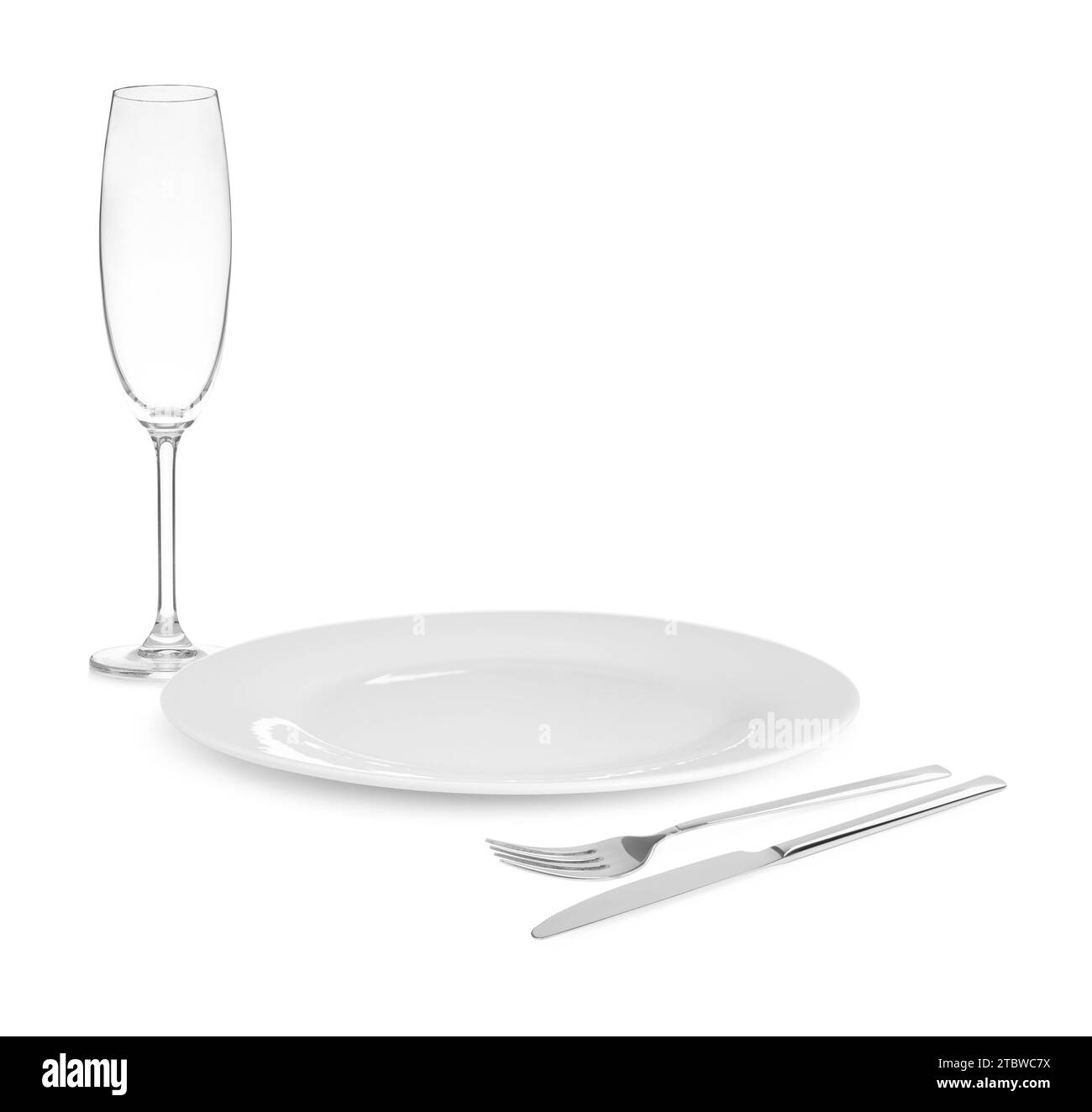 Clean plate, cutlery and glass on white background Stock Photo
