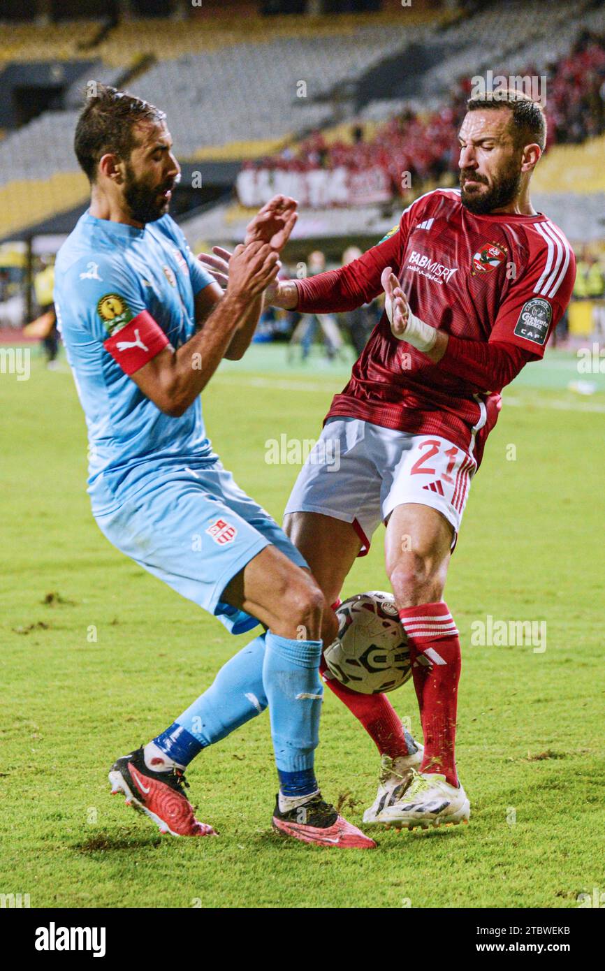 Alexandria, Egypt. 8th Dec, 2023. Ali Maaloul (R) of Al Ahly vies for the ball during the Confederation of African Football (CAF) Champions League football match between Al Ahly of Egypt and CR Belouizdad of Algeria in Alexandria, Egypt, Dec. 8, 2023. Credit: Ahmed Gomaa/Xinhua/Alamy Live News Stock Photo