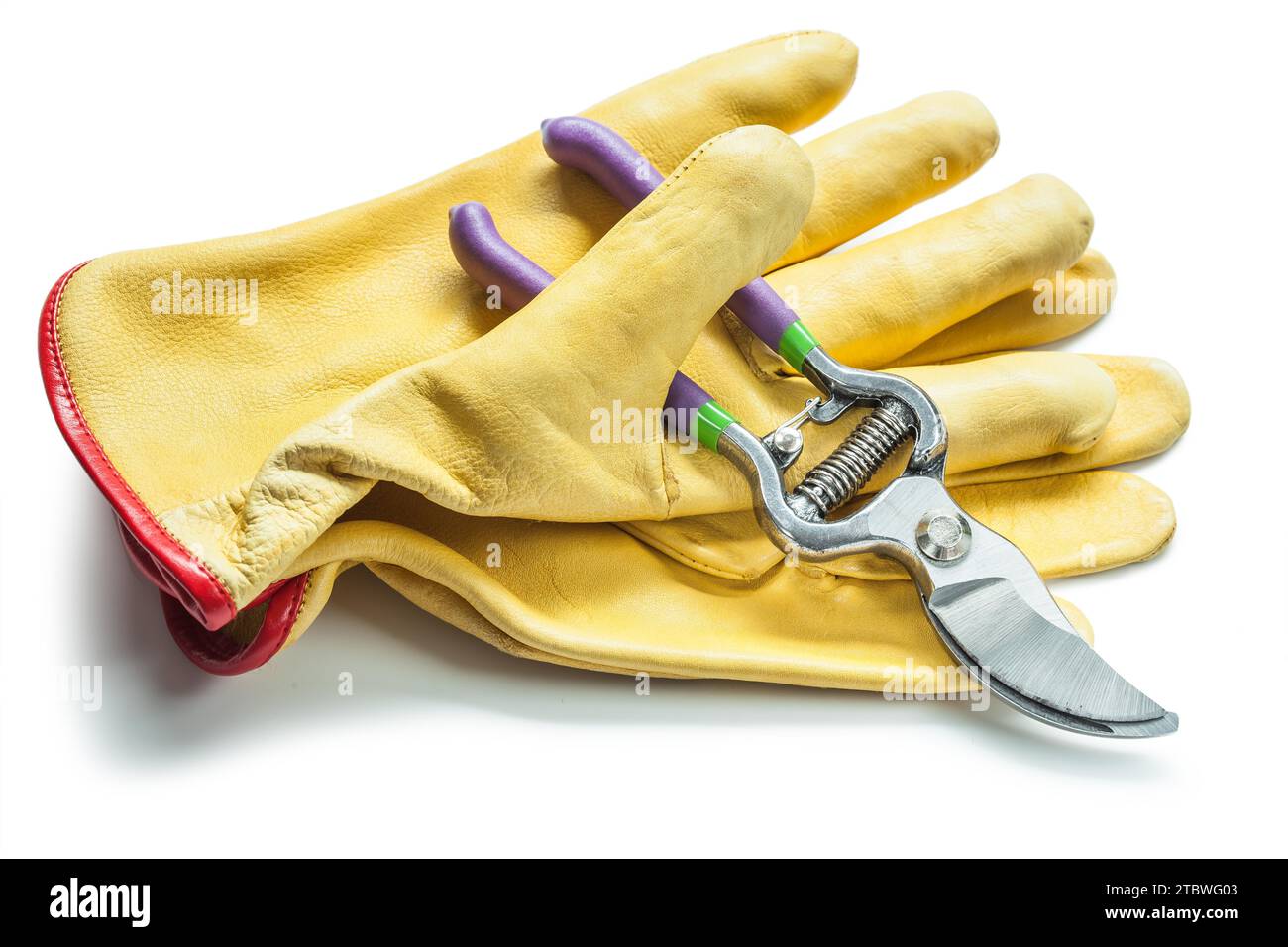 Secateurs and yellow leather gloves isolated on white Stock Photo