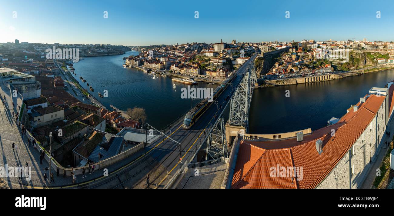 A panorama picture of Porto, showing the city, the Douro river and the Luis I bridge, while the subway passes by the upper deck Stock Photo