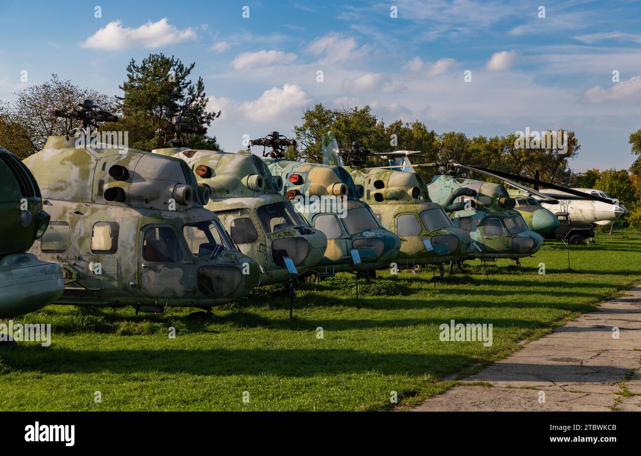A picture of a row of military helicopters on the grounds of the Polish Aviation Museum Stock Photo