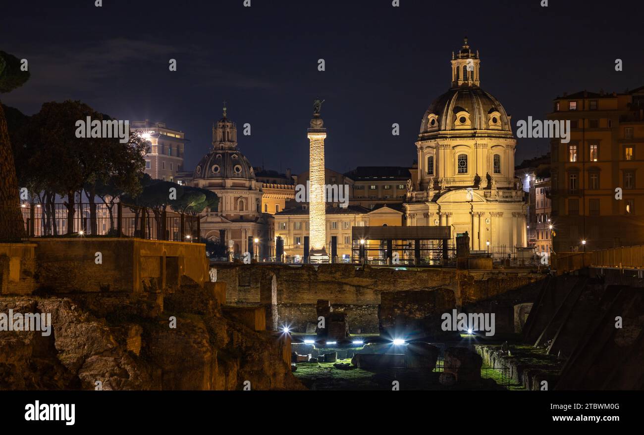 A picture of the Trajan's Column, the Church of Saint Mary of Loreto and the Church of the Most Holy Name of Mary at the Trajan Forum at night Stock Photo