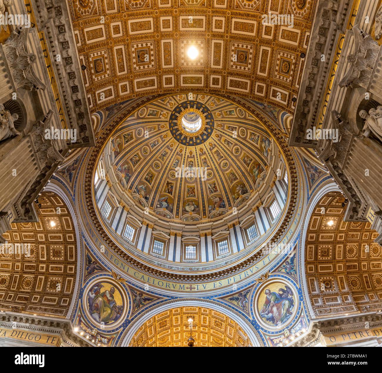 A picture of the huge dome of the St. Peter's Basilica and the surrounding frescoes and architecture as seen from the inside Stock Photo