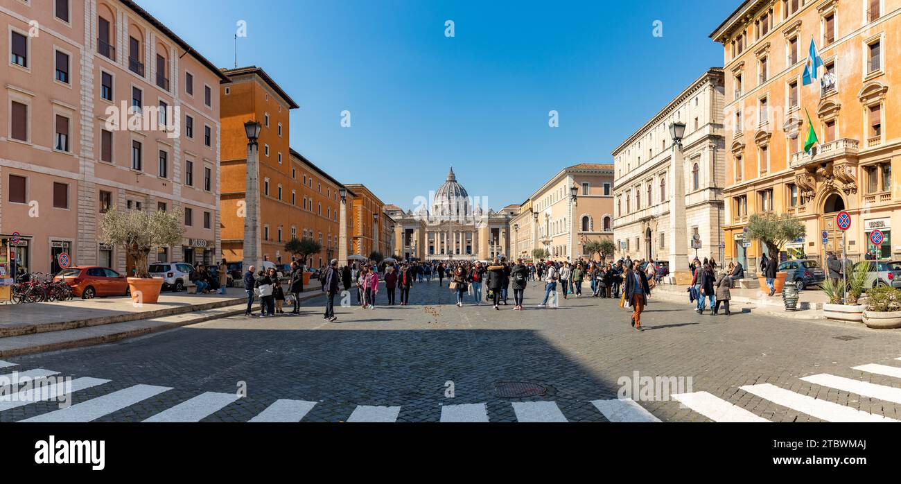 A picture of the Saint Peter's Basilica as seen from the Via della Conciliazione with many people Stock Photo