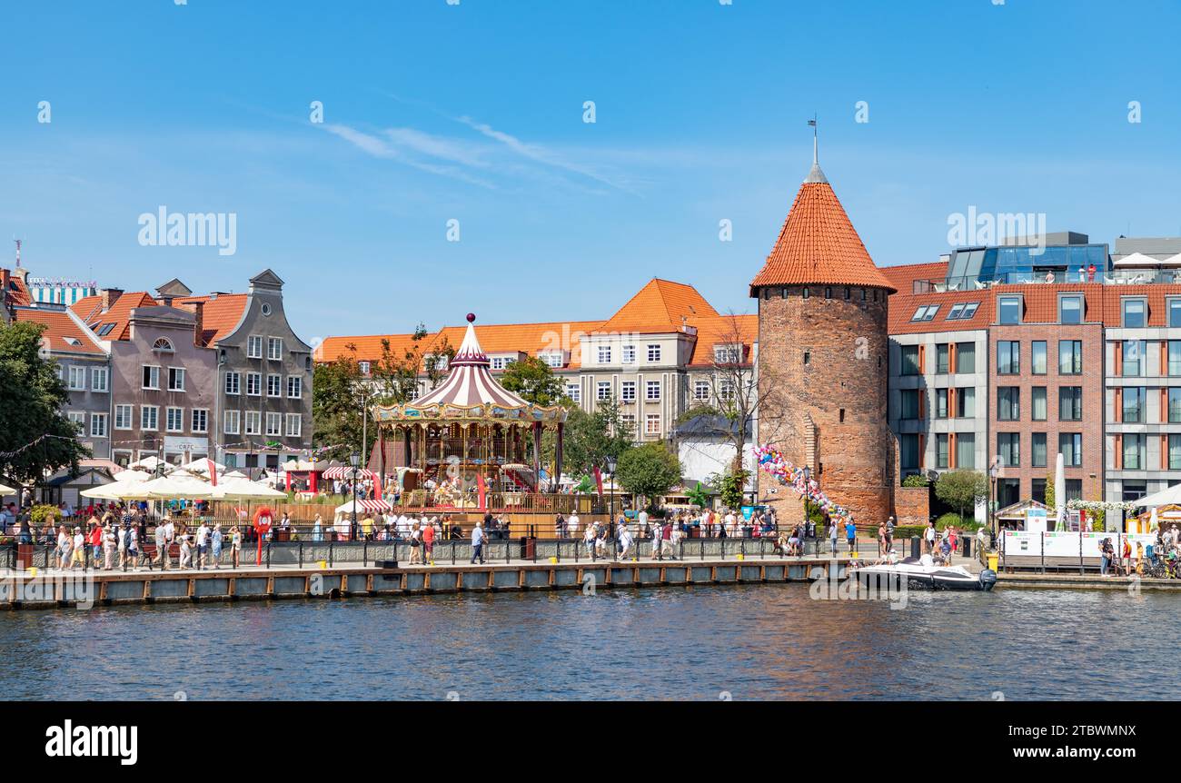 A picture of the Swan Tower and a Merry Go Round in St. Dominic's Fair (Gdansk) Stock Photo