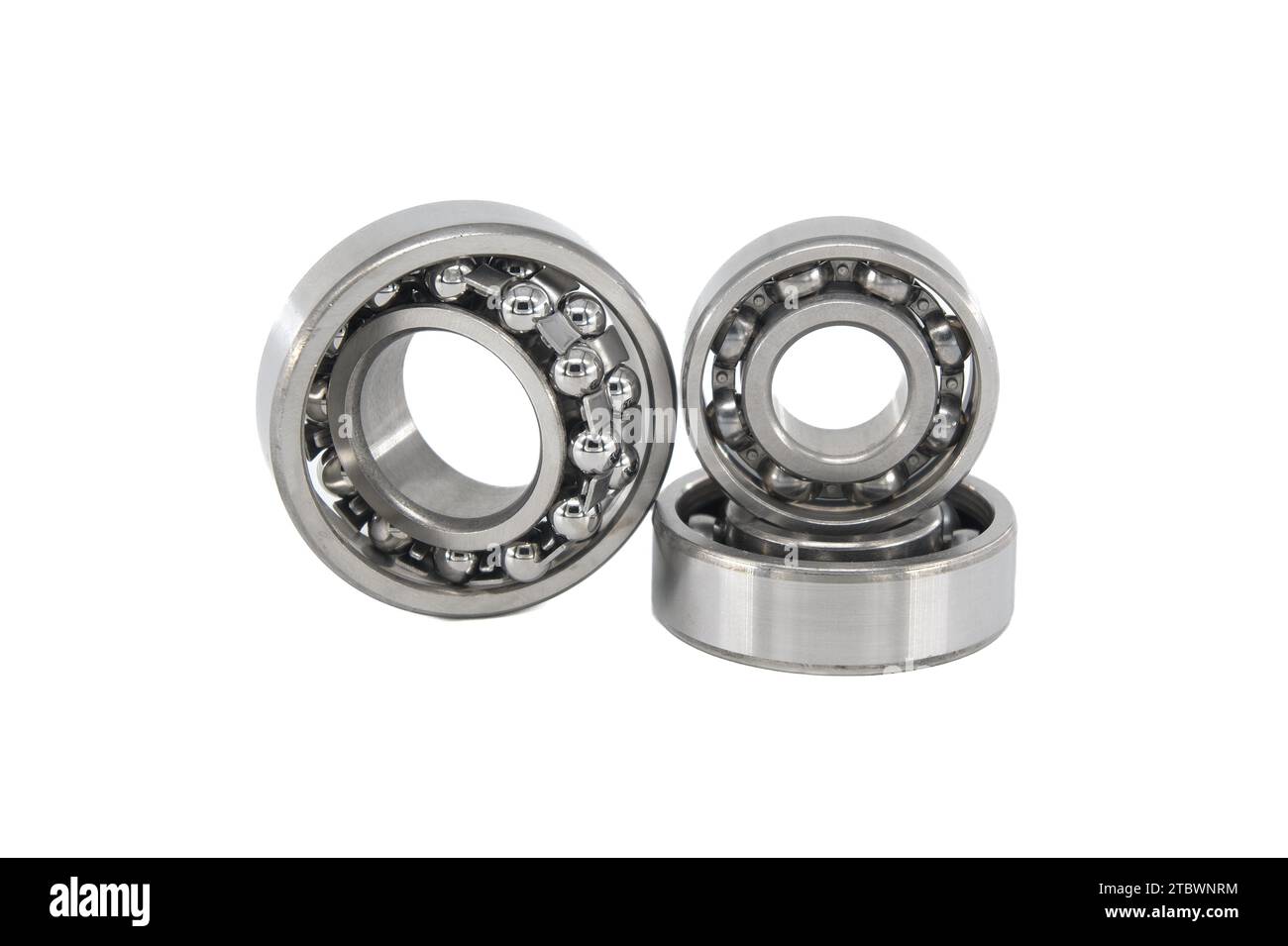 Group of various ball and roller bearings on white background. Spare
