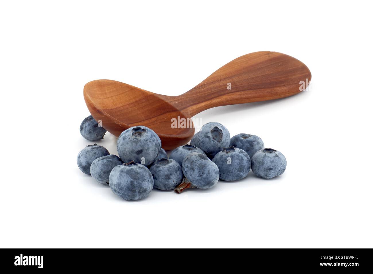 Blueberries near wooden spoon isolated on white background, full depth of field Stock Photo