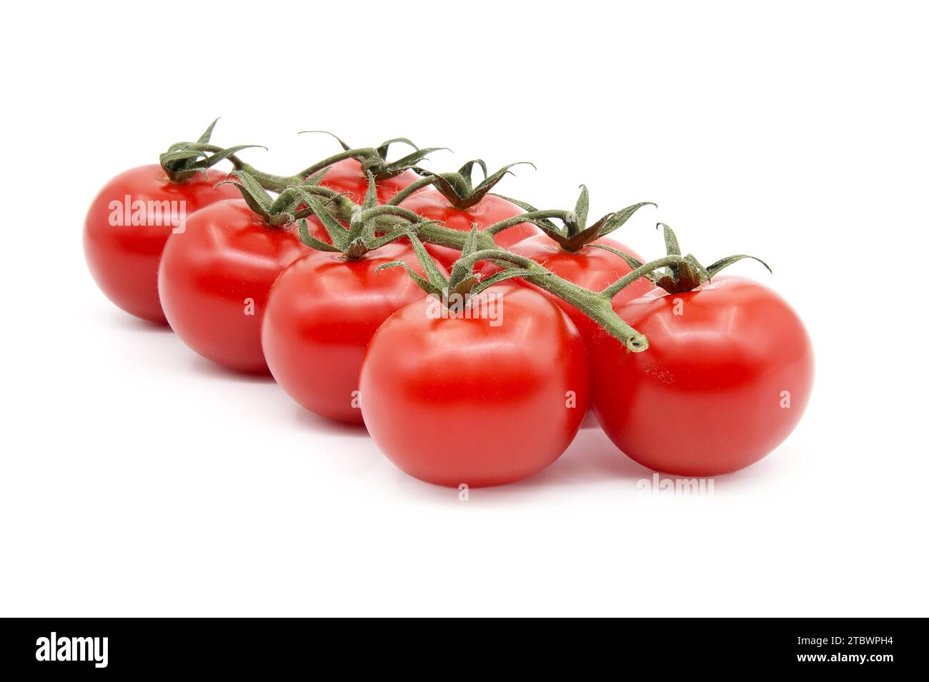 Cherry tomatoes twig isolated on white background Stock Photo