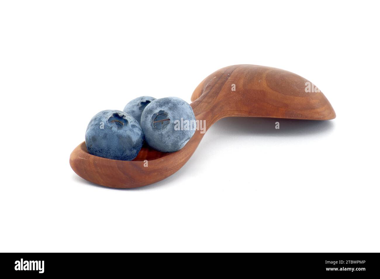 Blueberries in wooden spoon isolated on white background, full depth of field Stock Photo