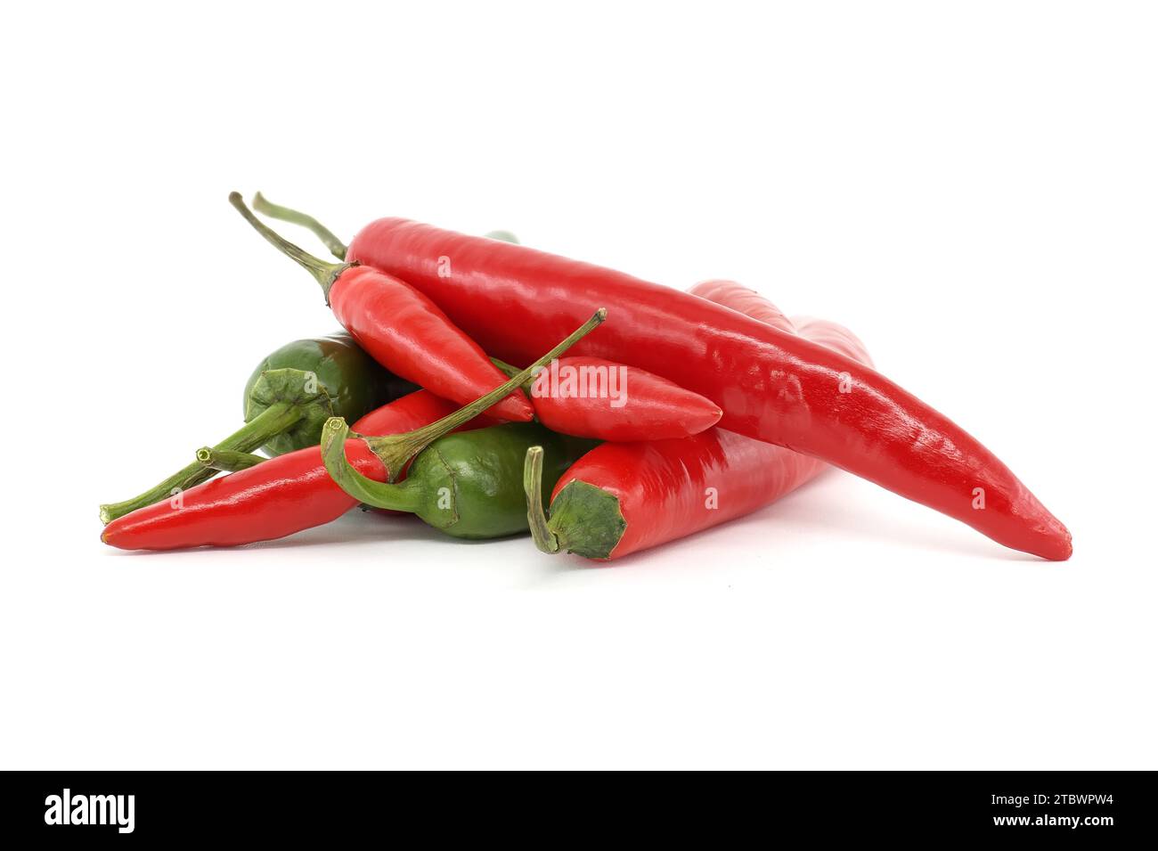 Stack of fresh red and green chili peppers isolated on white background ...