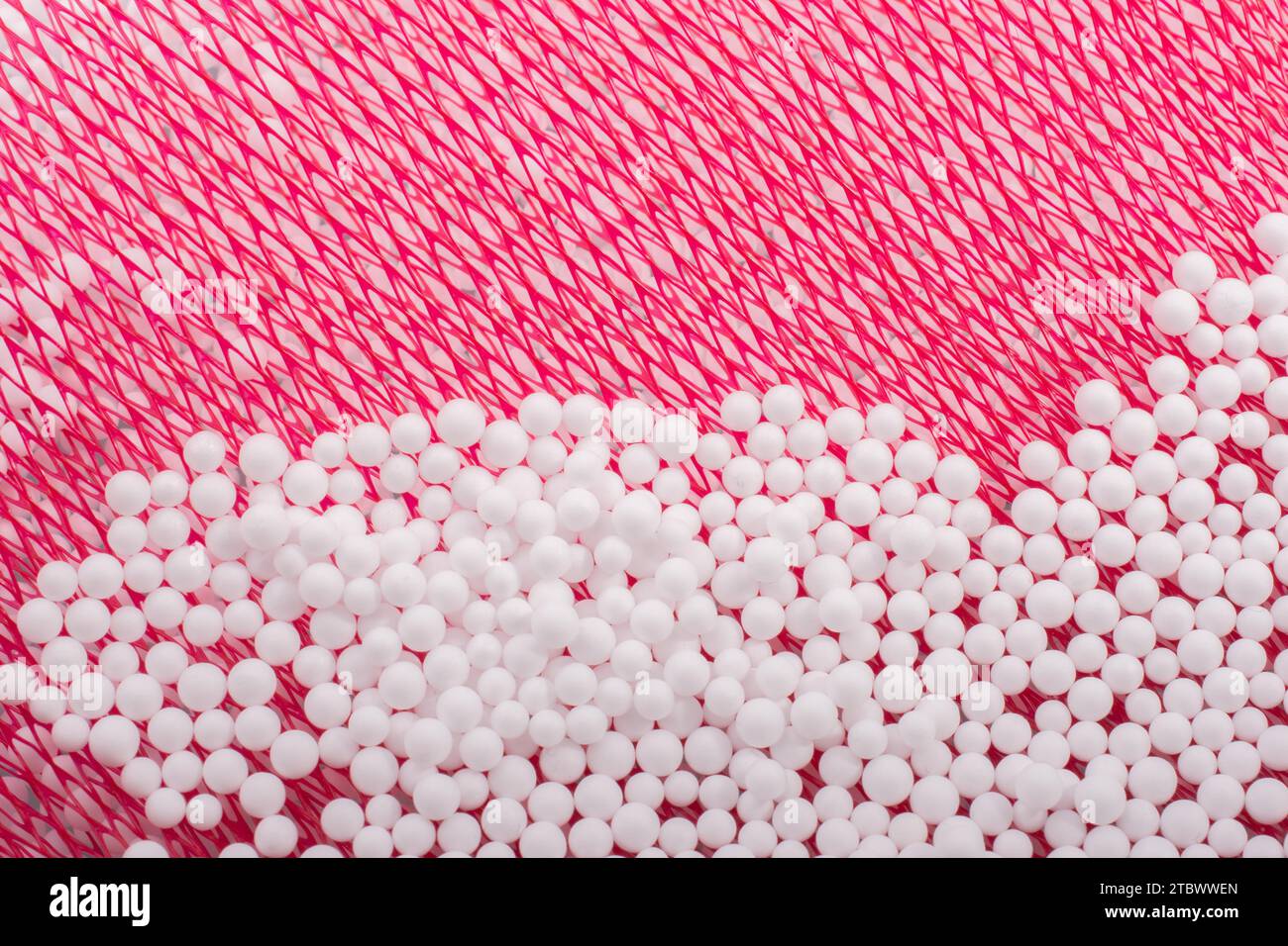 White little polystyrene foam balls as background Stock Photo - Alamy