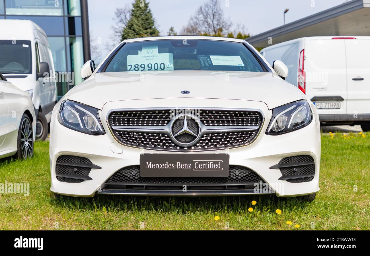 A picture of a white Mercedes Benz Class C Coupe at a car dealership Stock Photo
