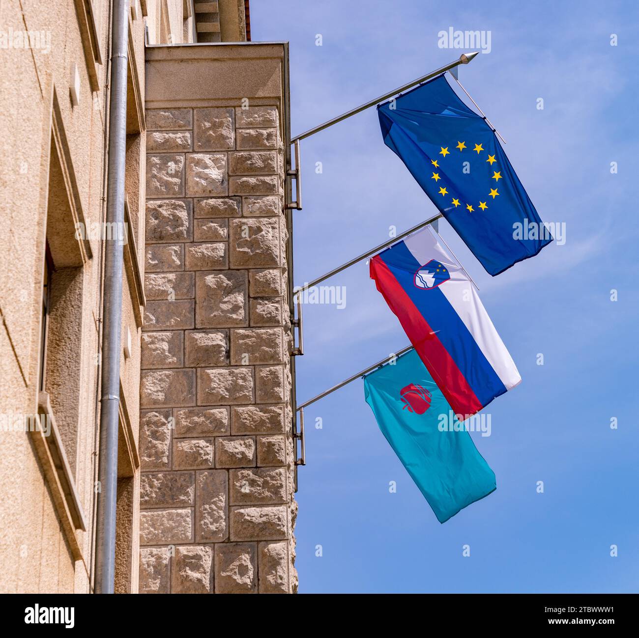 A picture of the flags on the facade of a government building in Nova Gorica, Slovenia Stock Photo