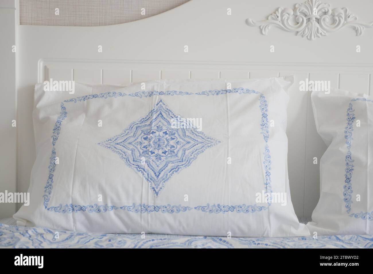 white pillow lined up on bed  Stock Photo
