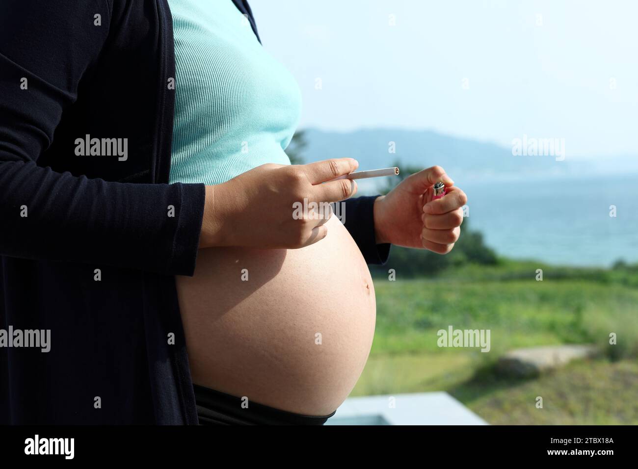 Pregnant woman smoking cigarette hires stock photography and images Alamy