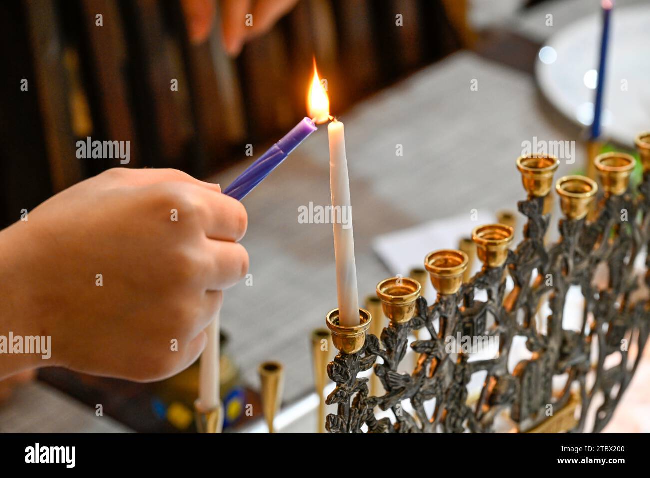 Beautiful Hannukah Jewish holiday scene lighting of the menorah