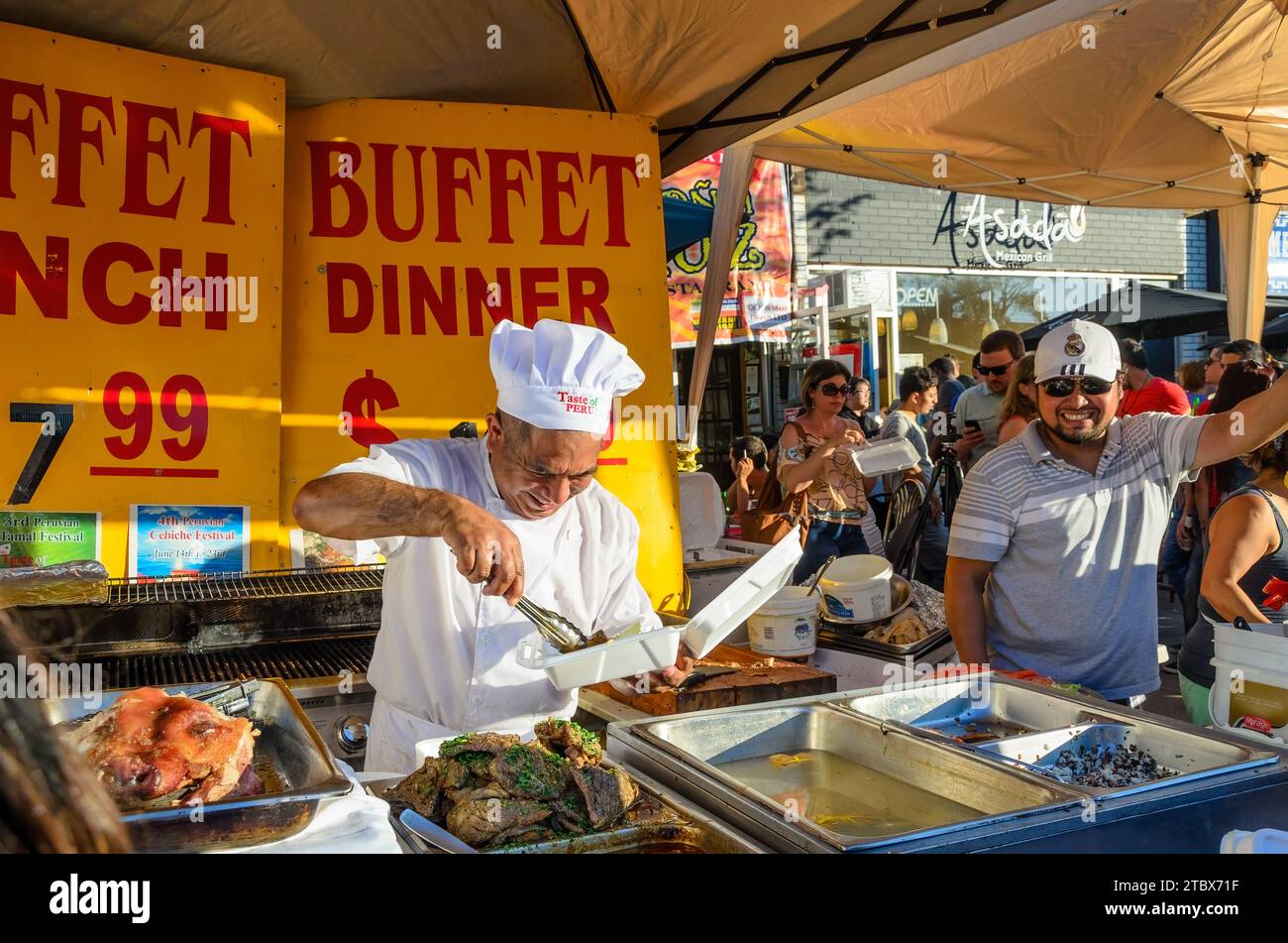 Latin American Chef serving food on a kiosk during Salsa on St. Clair traditional festival, Toronto, Canada Stock Photo